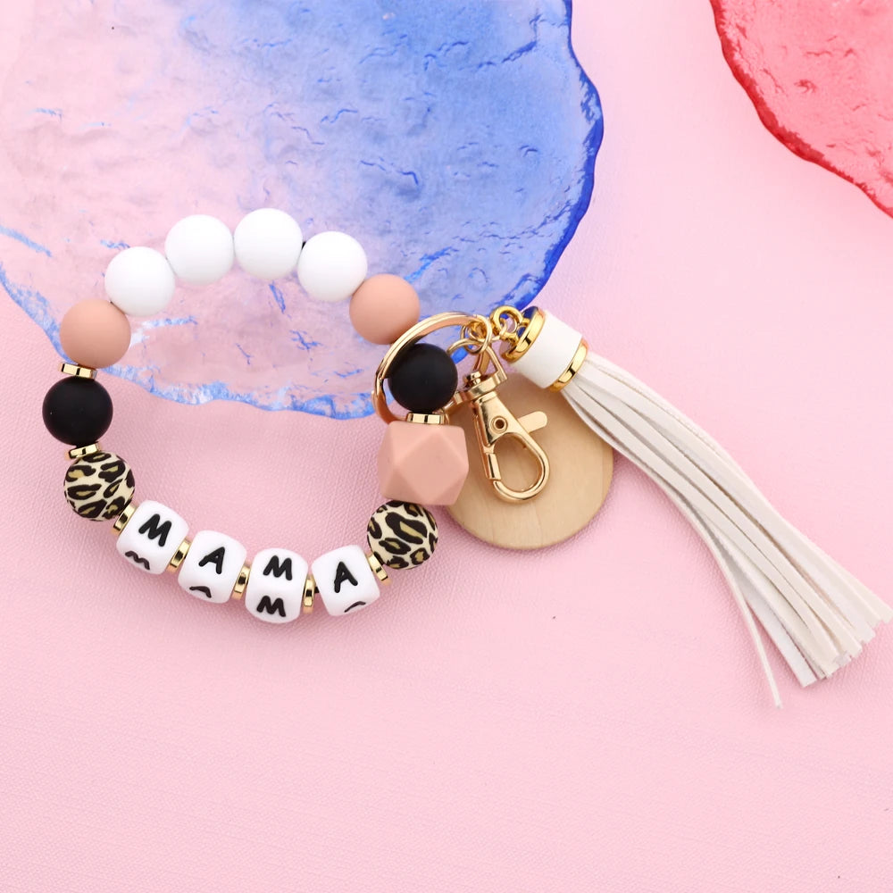 Leopard silicone bead key chain for women featuring white and pink beads and a gold clasp