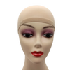 A mannequin head wearing a beige stretch mesh wig net cap with purple eyeshadow and red lipstick.