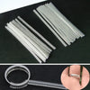 A set of four clear invisible ring size adjusters, including a ring and a long plastic extender.