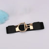 A black adjustable fashion belt with a gold round buckle and a light blue fluffy pom-pom.