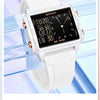 A white digital fashion watch with a black display and rose gold accents is shown on a wrist.