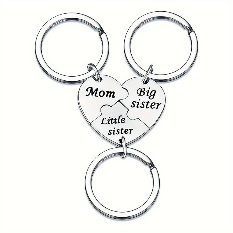 Silver keychain set featuring puzzle heart charms labeled Mom, Big sister, and Little sister