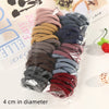A collection of 100 high elasticity hair ropes in various shades of brown, gray, and burgundy packaged in a clear plastic bag