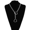 A black chunky heart slip chain necklace displayed on a black mannequin.