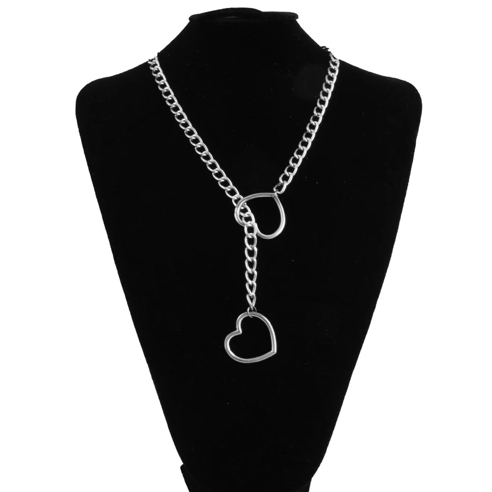 A black chunky heart slip chain necklace displayed on a black mannequin.