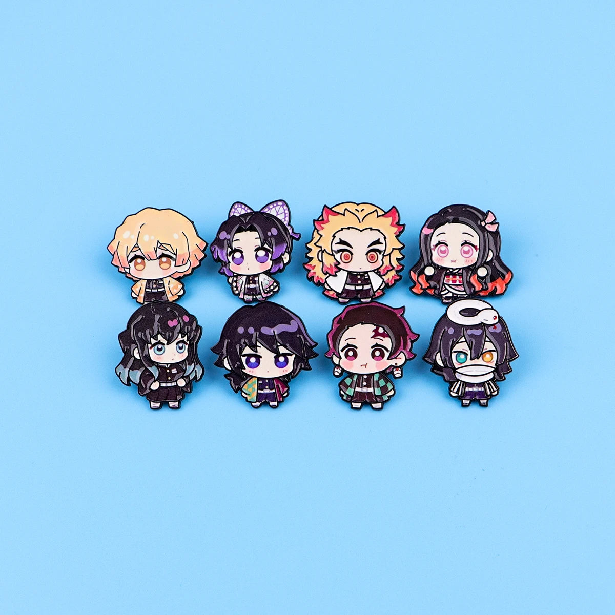 A set of eight cute enamel cartoon brooches featuring various stylized characters with different hair colors and expressions.