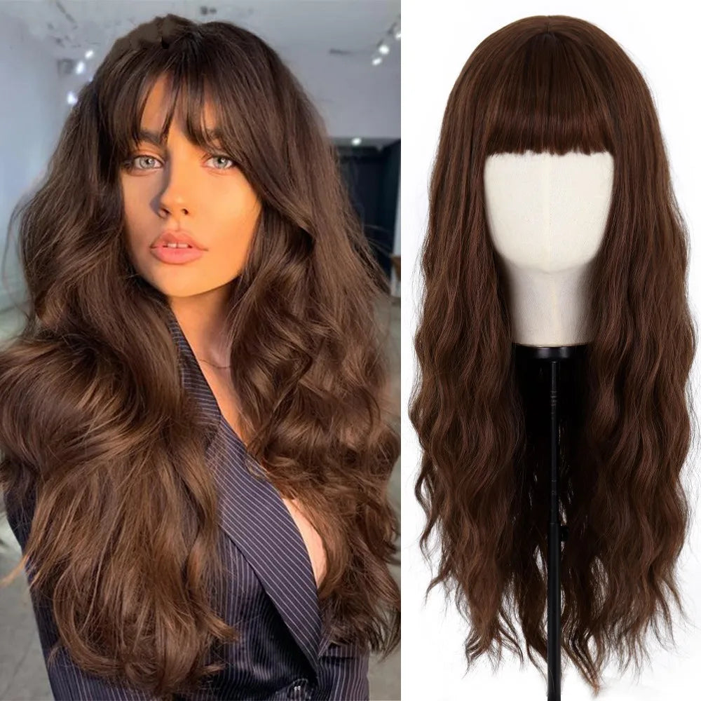 A woman modeling a long, wavy brown wig with dark hair against a blurred background.