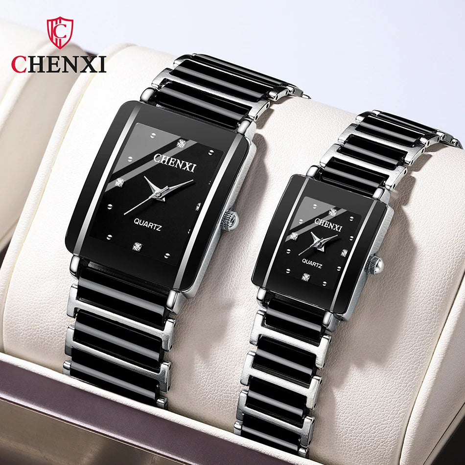 A pair of black and silver ceramic fashion wristwatches displayed in a light-colored box.