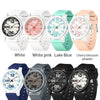 A selection of classic quartz fashion watches in white, pink, blue, and black finishes.