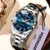 A silver and gold men's quartz watch with a blue luminous dial and black strap is displayed on a light background.