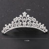A sparkling crystal princess tiara hair comb for women with a crown design.