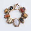 Boho gold plated resin statement choker necklace featuring various polished stones.