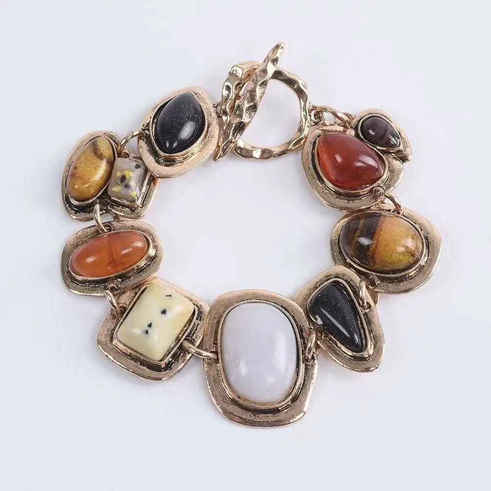 Boho gold plated resin statement choker necklace featuring various polished stones.