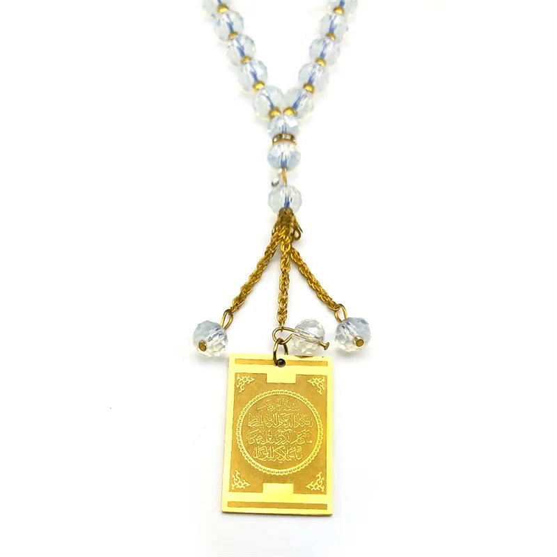 A stainless steel Quran Arabic car pendant jewelry featuring a gold chain and clear beads.