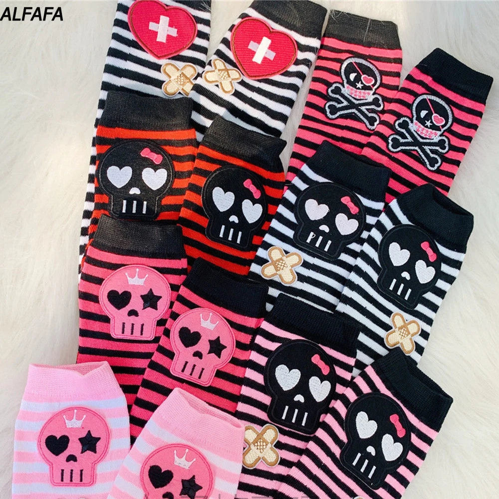 A collection of black and pink skull patterned fingerless accessories for Y2K grunge style.