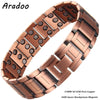 A copper magnetic bracelet with a textured surface and round magnetic studs on a wrist.