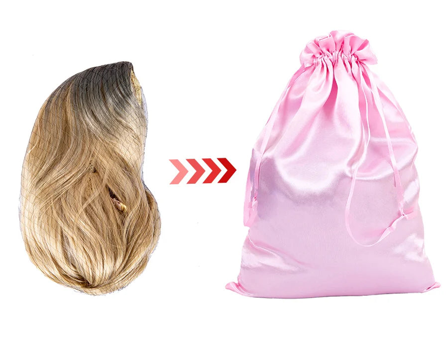 Pink satin storage bag with drawstring next to a light blonde wig.