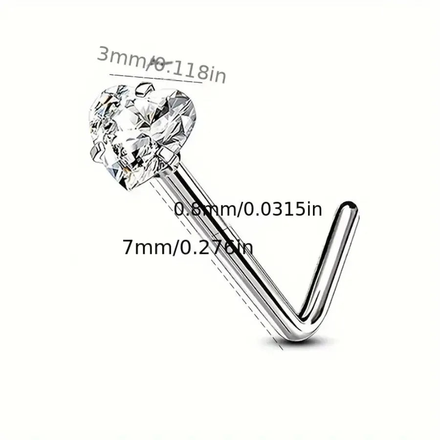 A close-up view of a silver heart star zirconia nostril stud earring with a curved post.