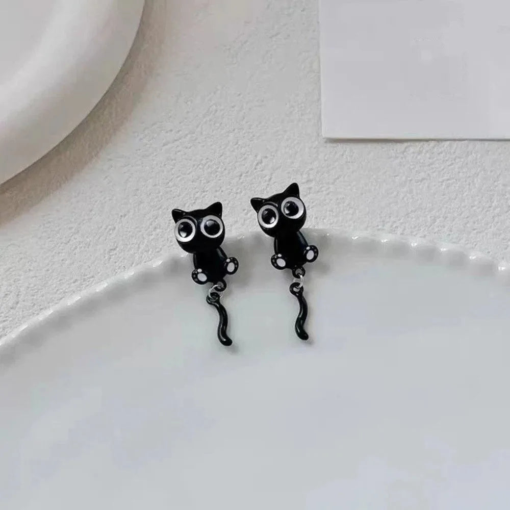 Pair of black cat stud earrings featuring a cute, detailed cat design.