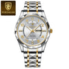 A silver and gold luxury men's quartz watch with a diamond-cut crystal face and metal bracelet.