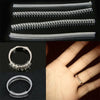 A set of four clear plastic invisible ring size adjusters shown in various arrangements and on a hand.