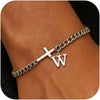 A close-up of a silver stainless steel cross Cuban chain bracelet worn on a wrist.