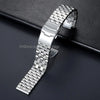 A silver stainless steel watch band with a checkered texture is displayed on a dark surface.