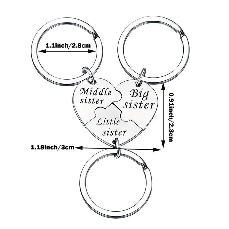 Silver keychain set featuring a puzzle heart design with labels for middle, big, and little sister