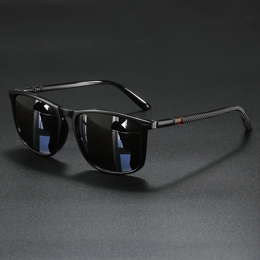 Black vintage square polarized cycling sunglasses resting on a dark surface.