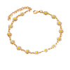 A delicate gold chain anklet featuring small yellow and white enamel daisy charms.