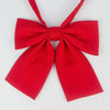 A bright red butterfly ribbon tie set featuring a bow and a long ribbon.