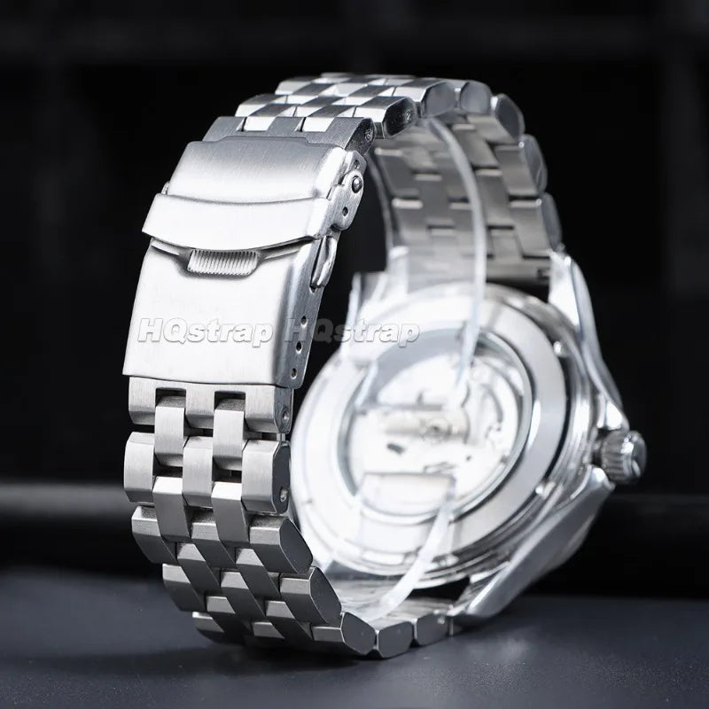 A close-up shot of an adjustable stainless steel watch featuring a textured metal band and a silver-toned watch case.
