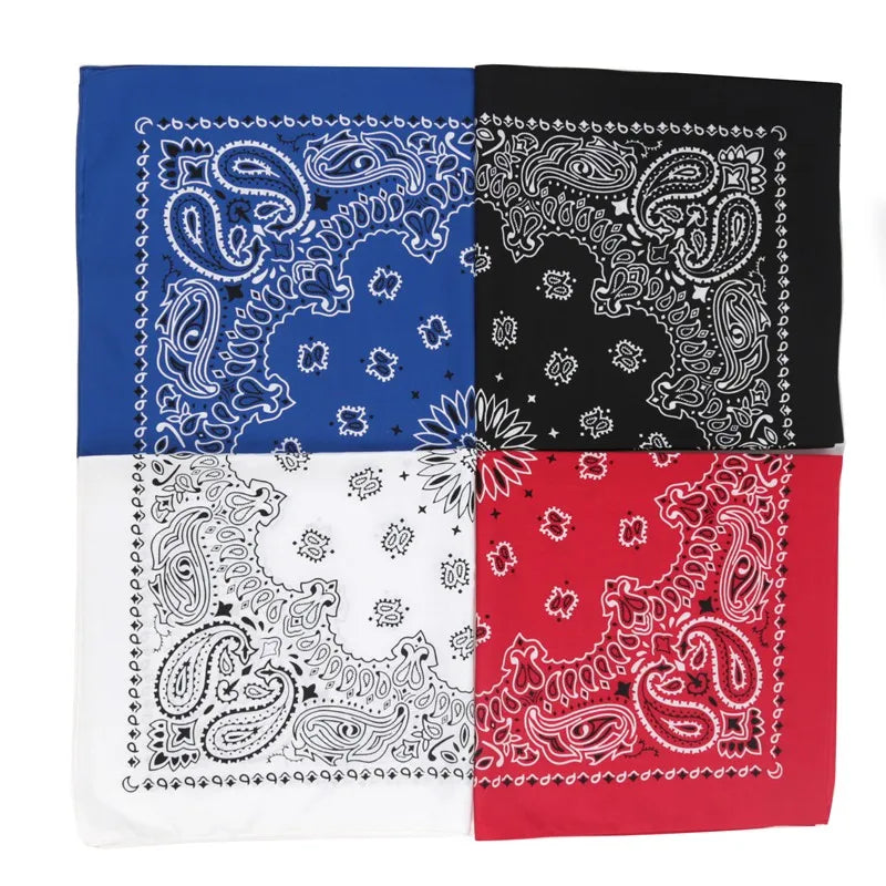 A four-panel fabric featuring paisley patterns in blue, black, white, and red.