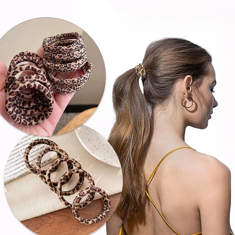 A woman is shown with a ponytail, holding leopard print elastic hair ties and a white accessory.