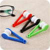 A collection of colorful silicone cleaning tools for eyeglasses, including rubber tips and plastic handles.