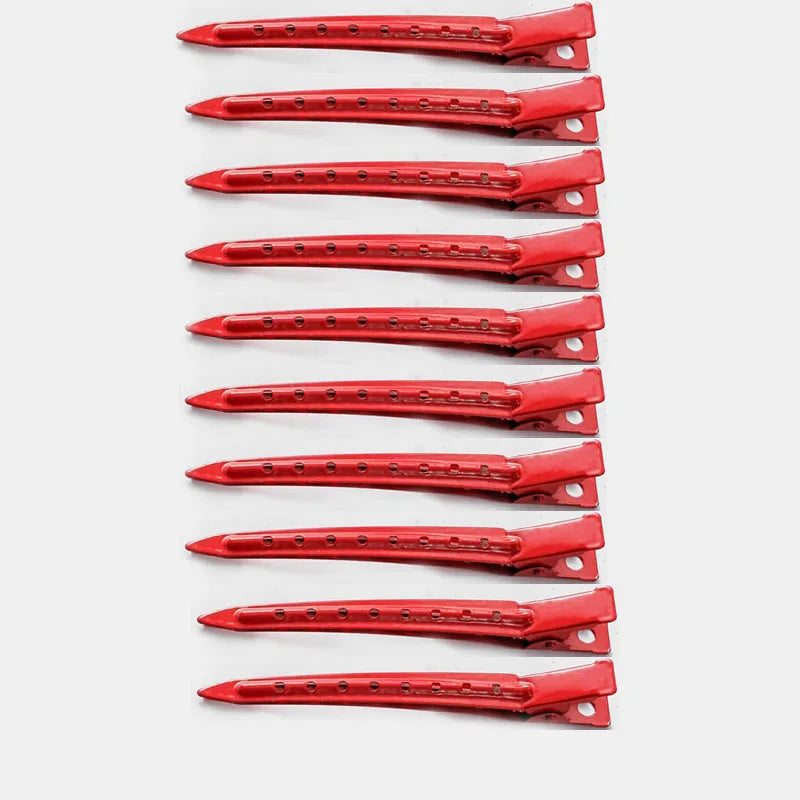 A set of red professional fixed hair pins for styling.