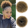 A woman shows off a Kinky Drawstring Ponytail Extension, featuring voluminous brown hair.
