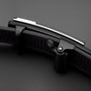 A close-up view of a black PU leather fashion belt with a silver buckle and dark brown leather strap.