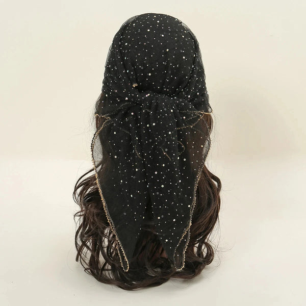 Black sheer hijab headscarf with scattered white dots and gold trim