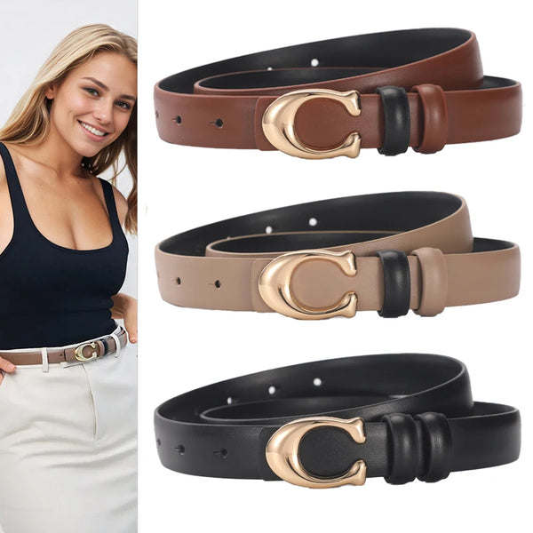 A set of smooth double-sided belts in brown and black leather with gold C-shaped buckles shown on a model.