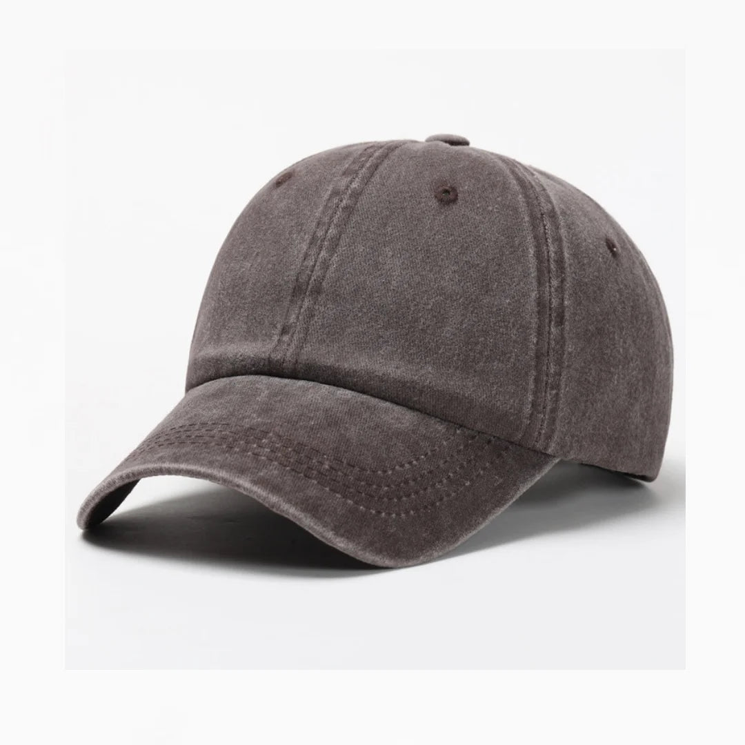 A dark gray washed cotton snapback cap shown from above.