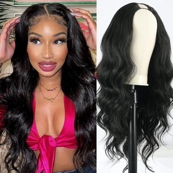 A close-up of a model wearing a long black body wave synthetic wig with a pink top and gold necklace.