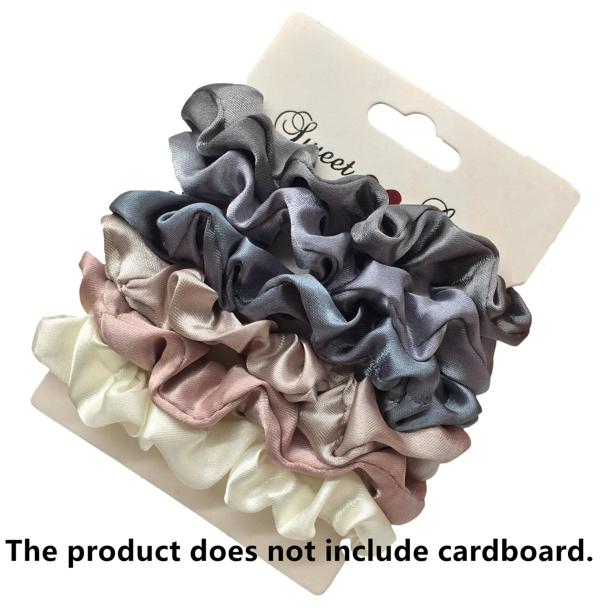 A set of five satin hair scrunchies in various shades of gray, pink, and white displayed on a cardboard backing.