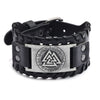 Black leather bracelet with a silver compass design and a buckle.