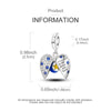 A sterling silver star moon charm bracelet featuring a heart pendant with blue stones.