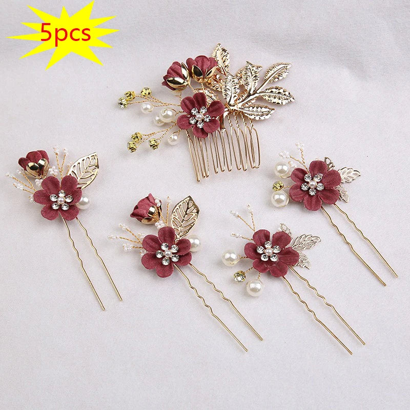 A set of five floral pearl bridal hair accessories featuring deep pink flowers and gold leaf accents.