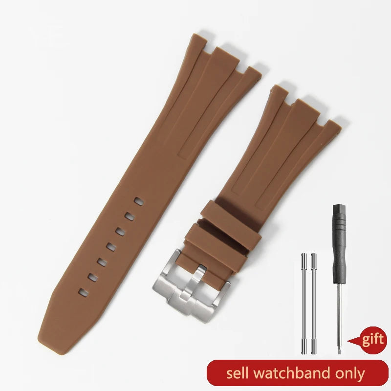 A brown silicone watch band with a quick-release buckle and a metal pin is shown on a white background.