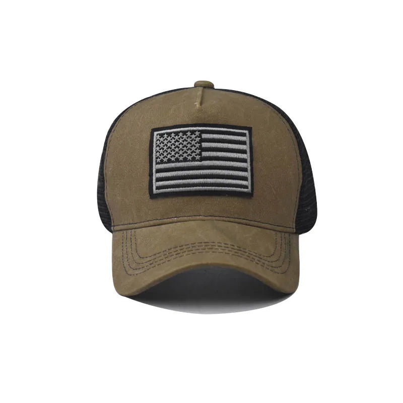 A khaki tactical baseball cap featuring a black and white American flag design on the front.