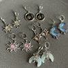 A collection of Y2K sun moon stainless steel hoop earrings featuring various celestial designs and colors.
