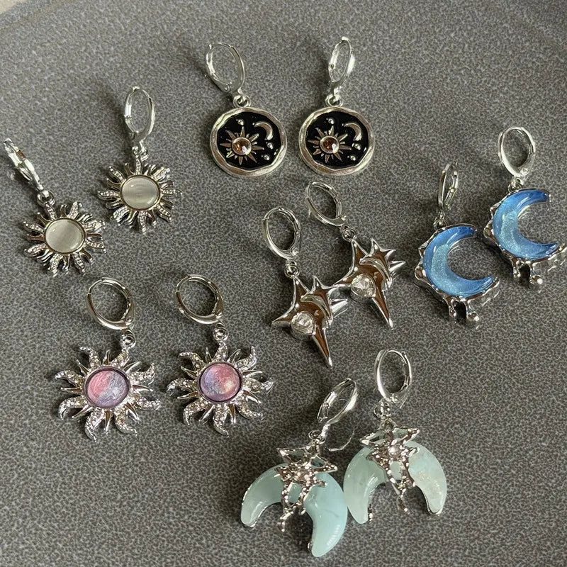 A collection of Y2K sun moon stainless steel hoop earrings featuring various celestial designs and colors.
